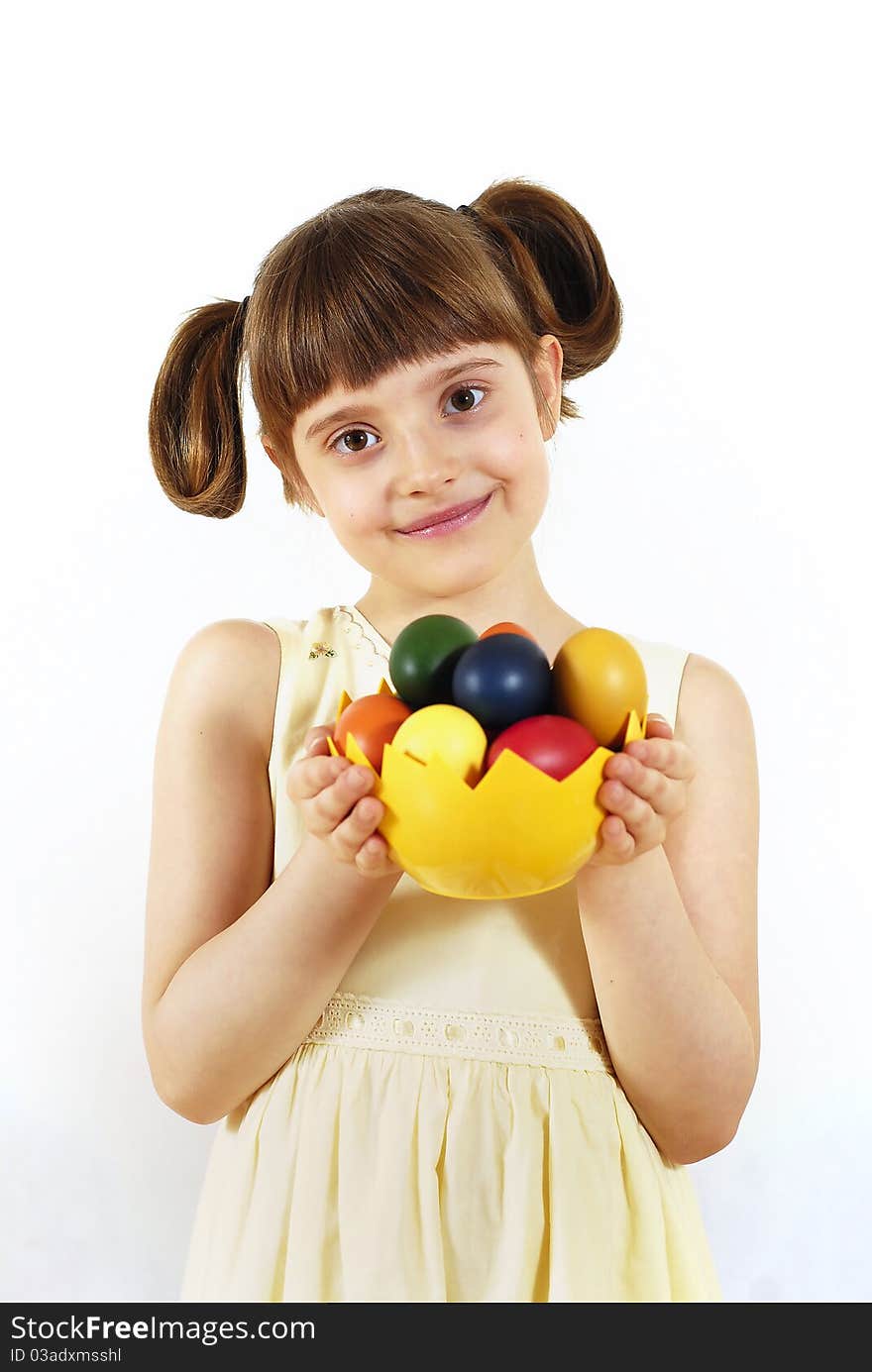 Girl keeping the basket with Easter painted eggs. Girl keeping the basket with Easter painted eggs