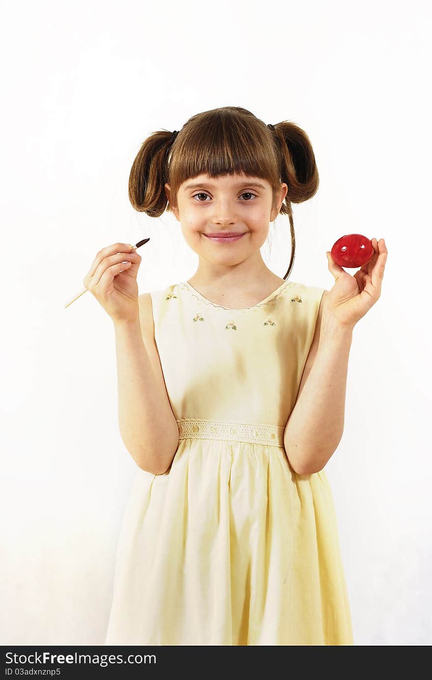 Girl with painted eggs