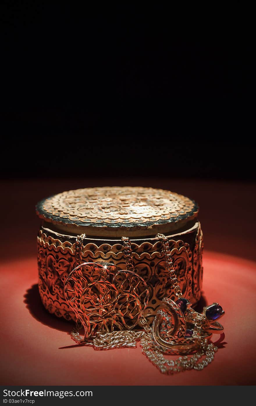 Wooden casket and adornment on black background