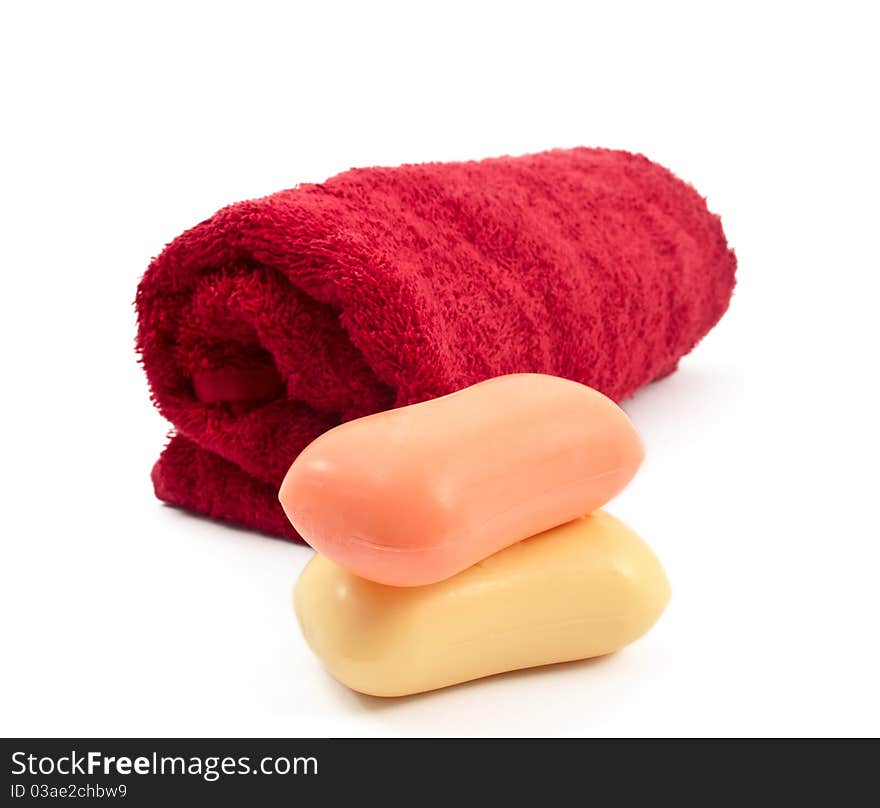 Towel and soap on a white background