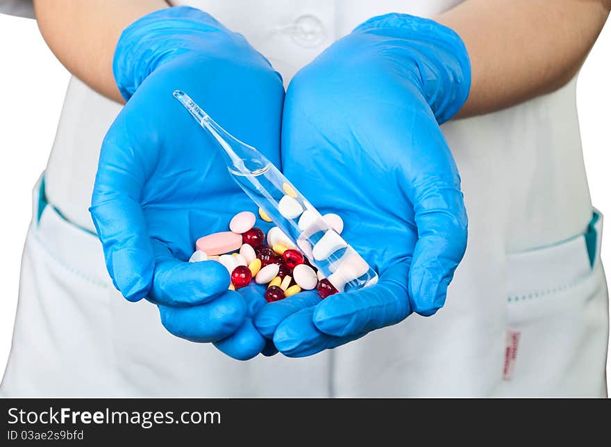 Drugs in the hands of a doctor on a white background