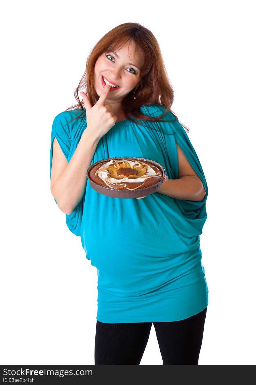 A smiling woman is tasting the cake. isolated on a white background