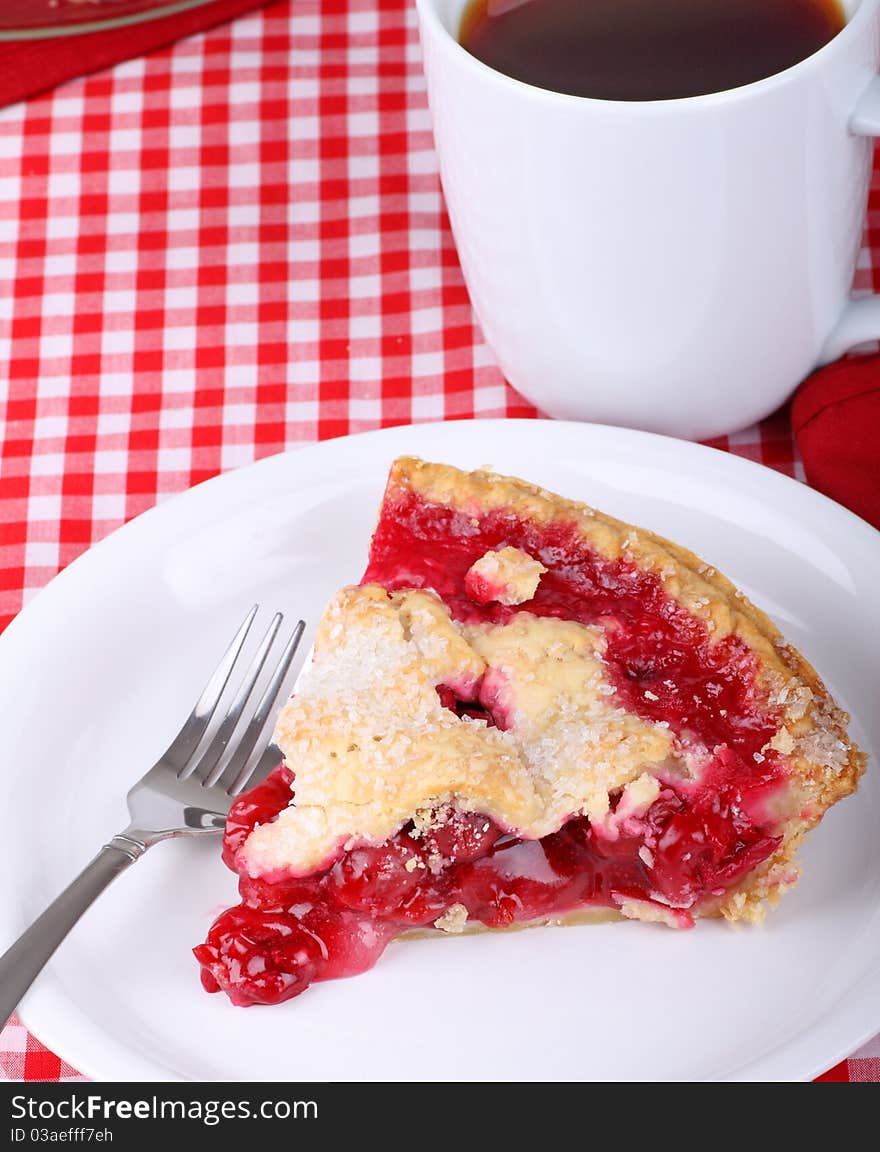 Slice of cherry pie and a cup of coffee