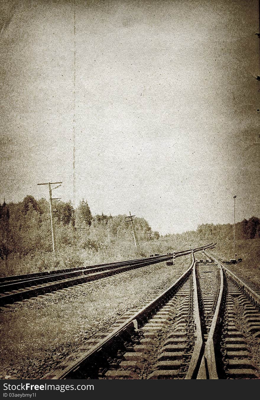 Railway in the forest on grunge background