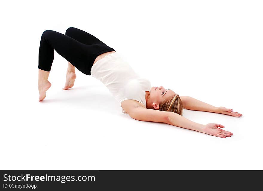 Beautiful girl practicing yoga on white background