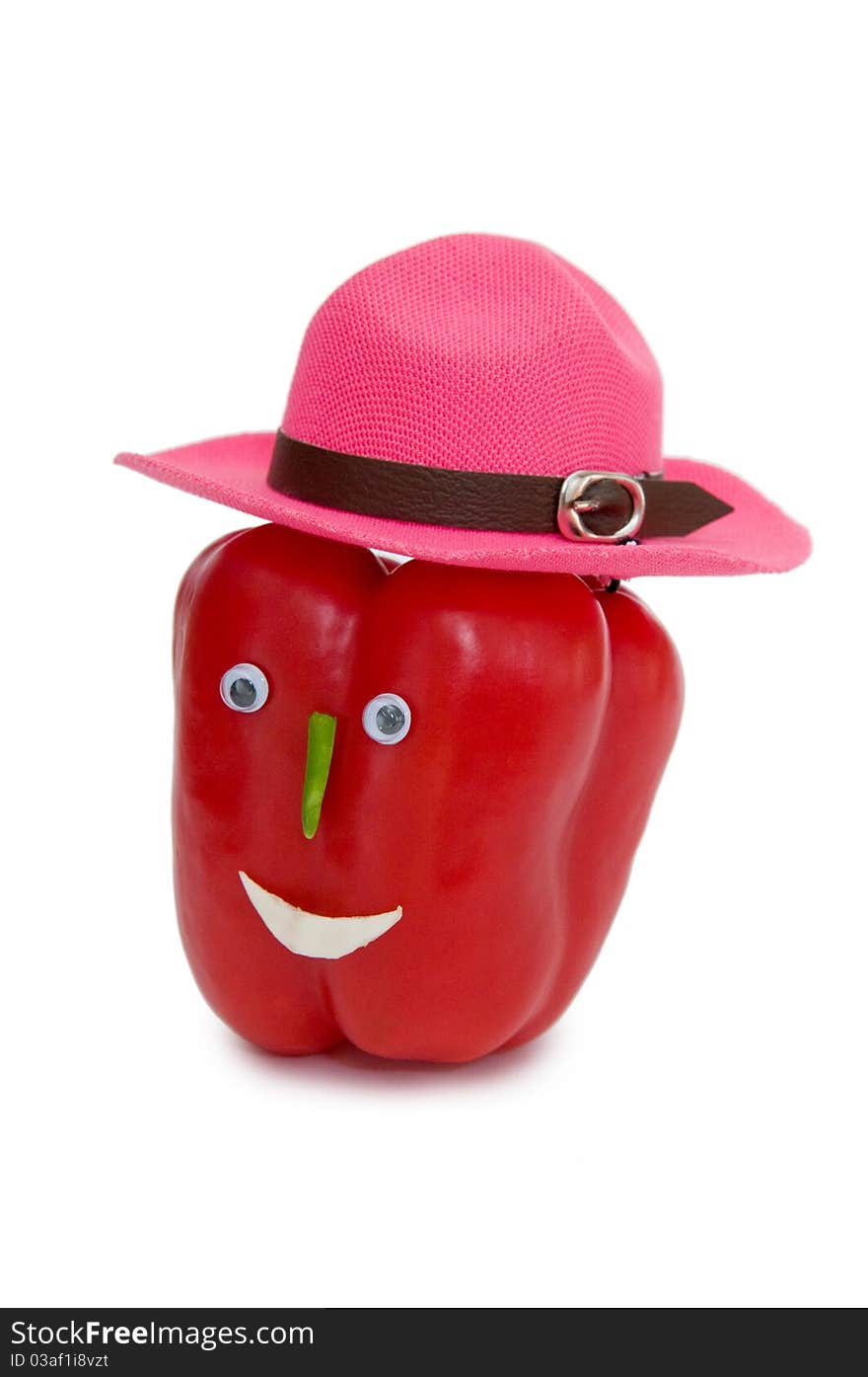 Amusing red sweet pepper in a hat. Amusing red sweet pepper in a hat