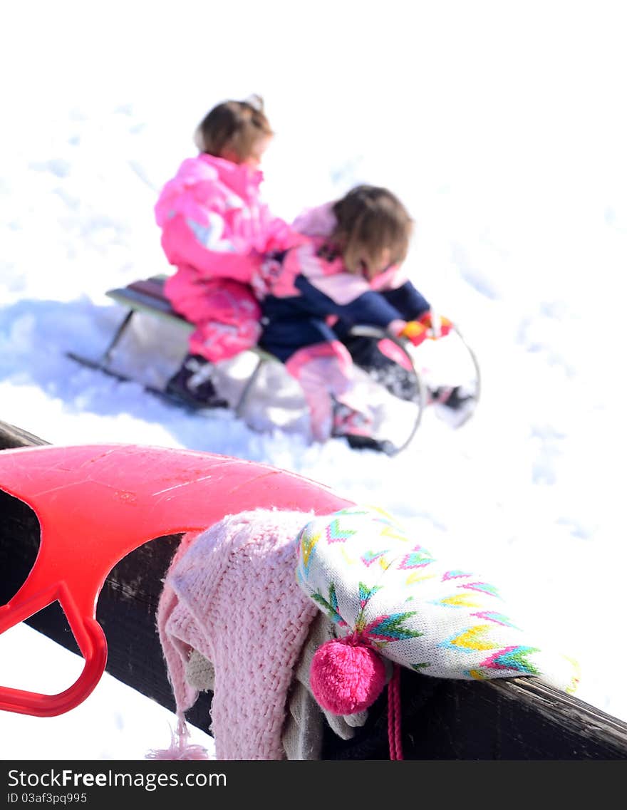 Winter scene with hat and children on the sledge. Winter scene with hat and children on the sledge