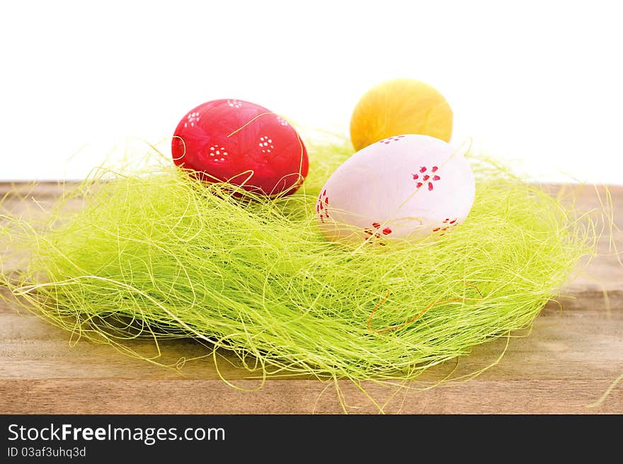 Colorful easter eggs on wooden background