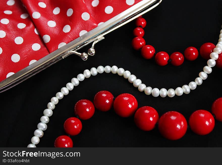 Stylish Purse and necklace on dark background