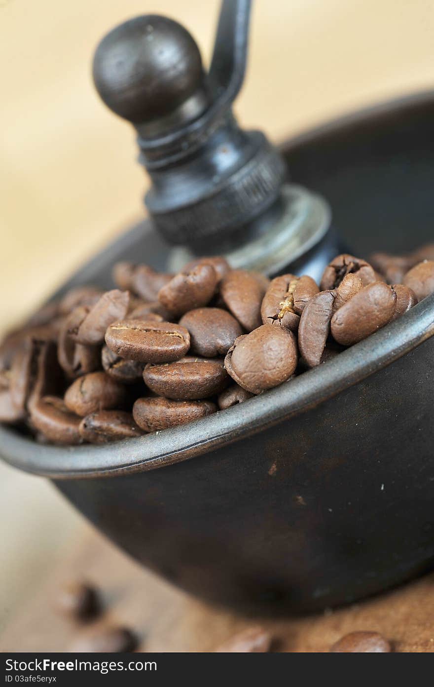 Vintage Manual coffee grinder with coffee beans isolated