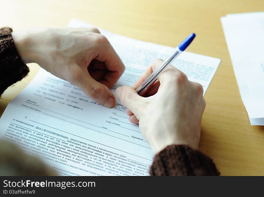 An image of male�s hand writing in the document. An image of male�s hand writing in the document