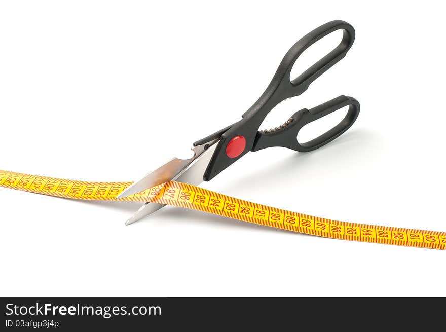 Scissors cutting a measuring on white background