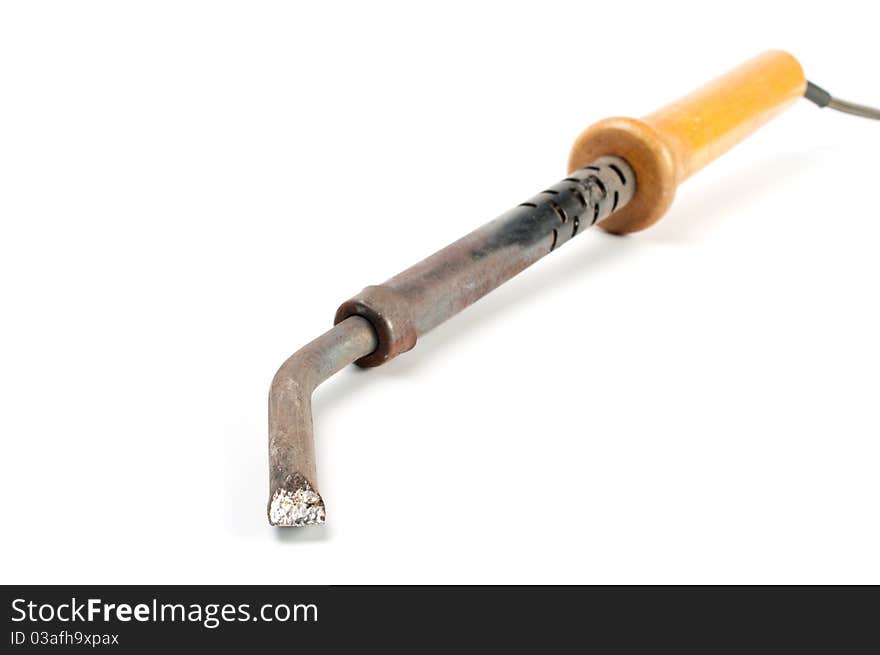 Soldering iron with a wooden handleron a white background.