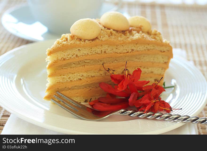 Caramel medovik cake made of honey and caramel cream, decorated with flowers