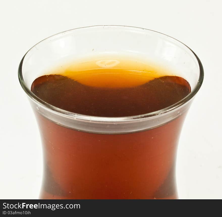 Black tea,clasic turkish glass on white background