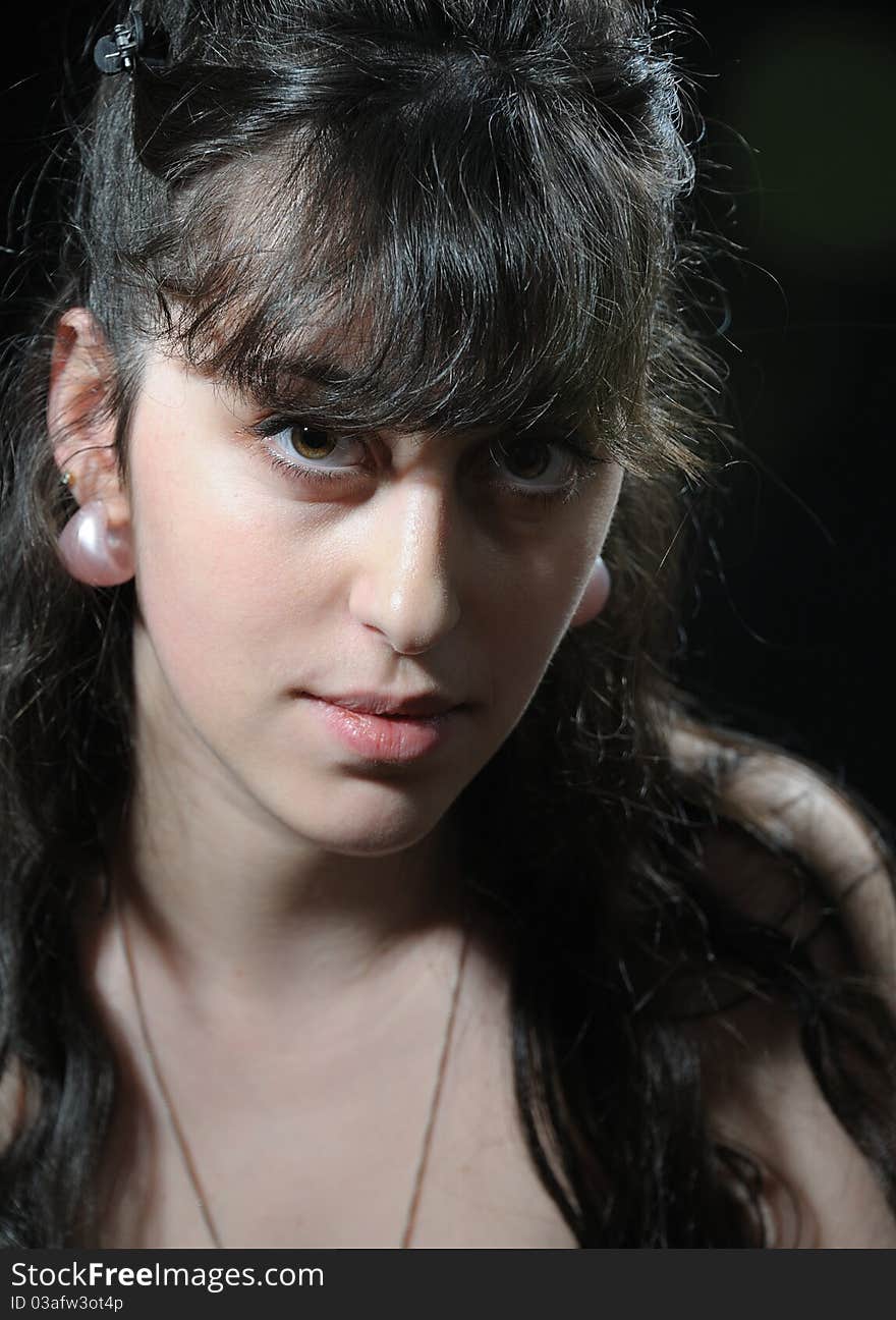 Portrait of  young brunette  girl  on black background. Portrait of  young brunette  girl  on black background