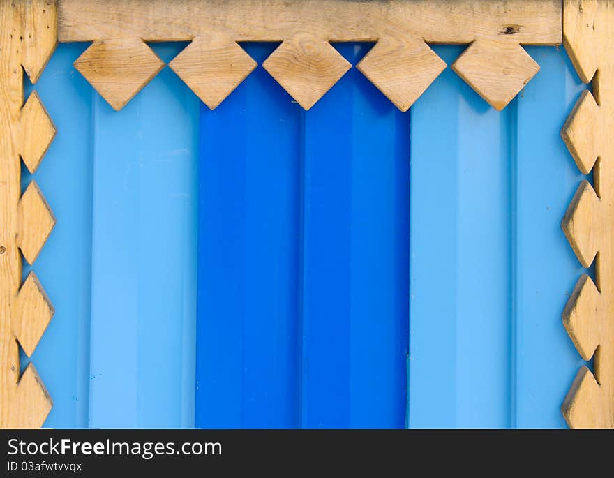 The coloured metal is framed a tree