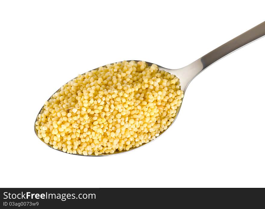 Millet in a spoon isolated on white background