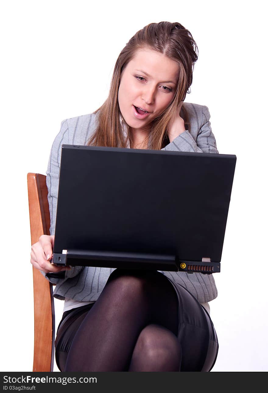 Young woman with laptop excited.