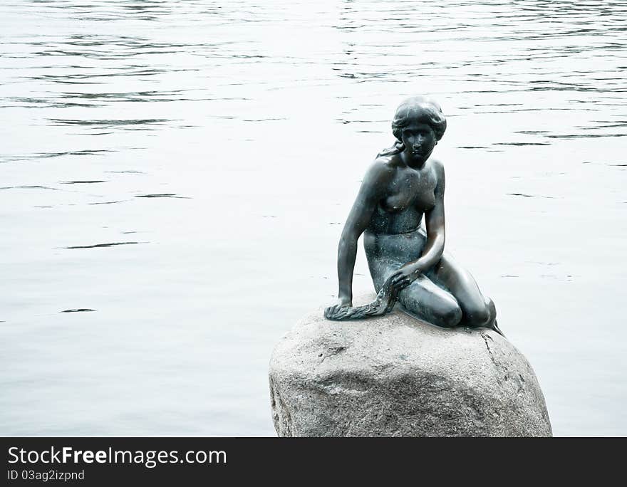 A maiden sitting on a stone in Copenhagen