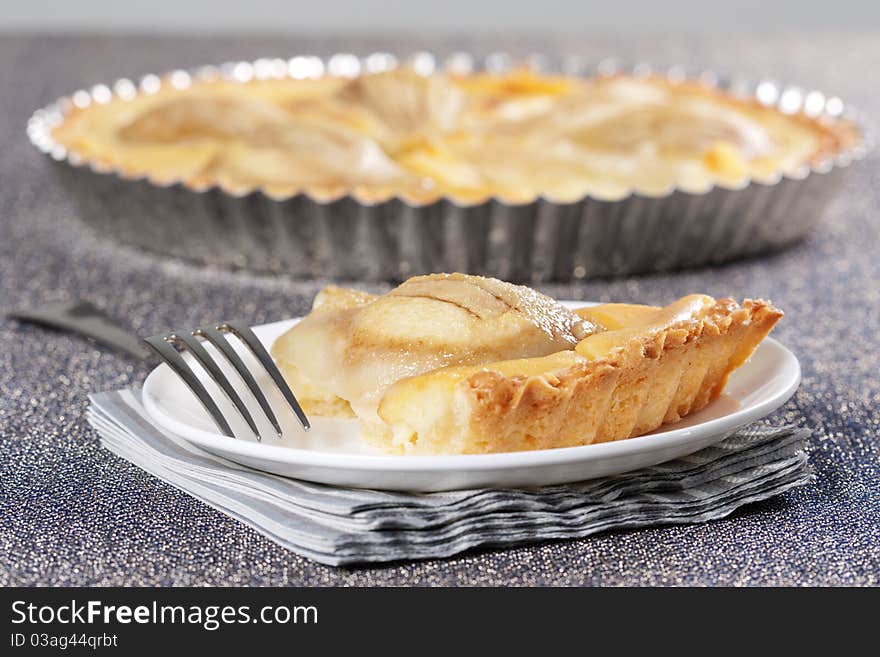 Tart from pears in the baking dish. Tart from pears in the baking dish