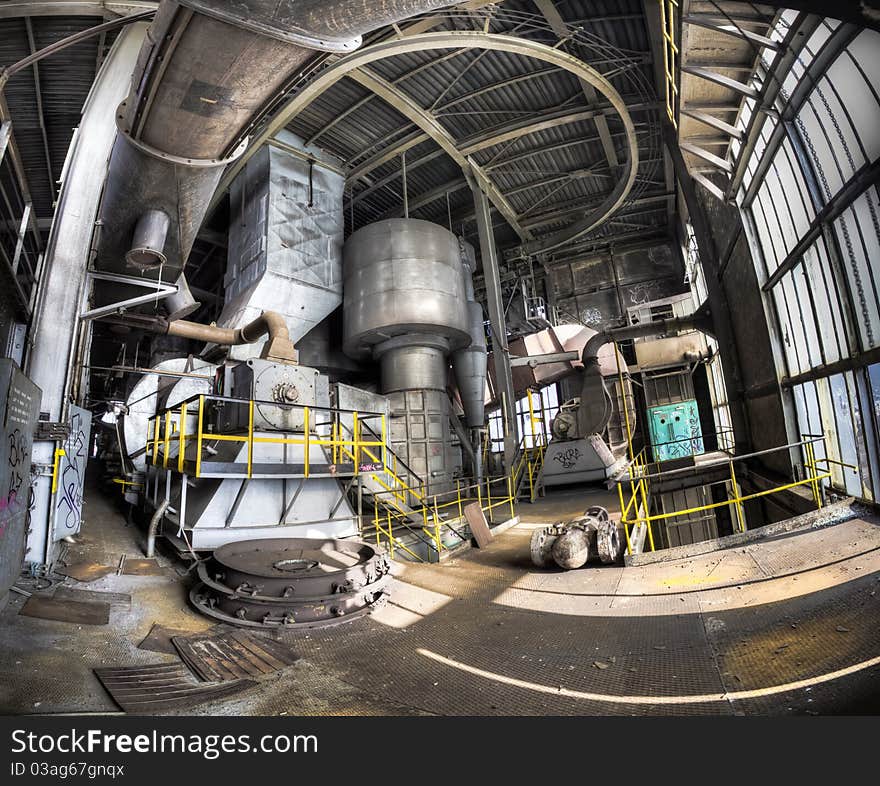 A panorama of the interior of an abandoned power station. Incoming sunlight creates a dramatic scenery, knowing people had a good job here, before the crisis. A panorama of the interior of an abandoned power station. Incoming sunlight creates a dramatic scenery, knowing people had a good job here, before the crisis.