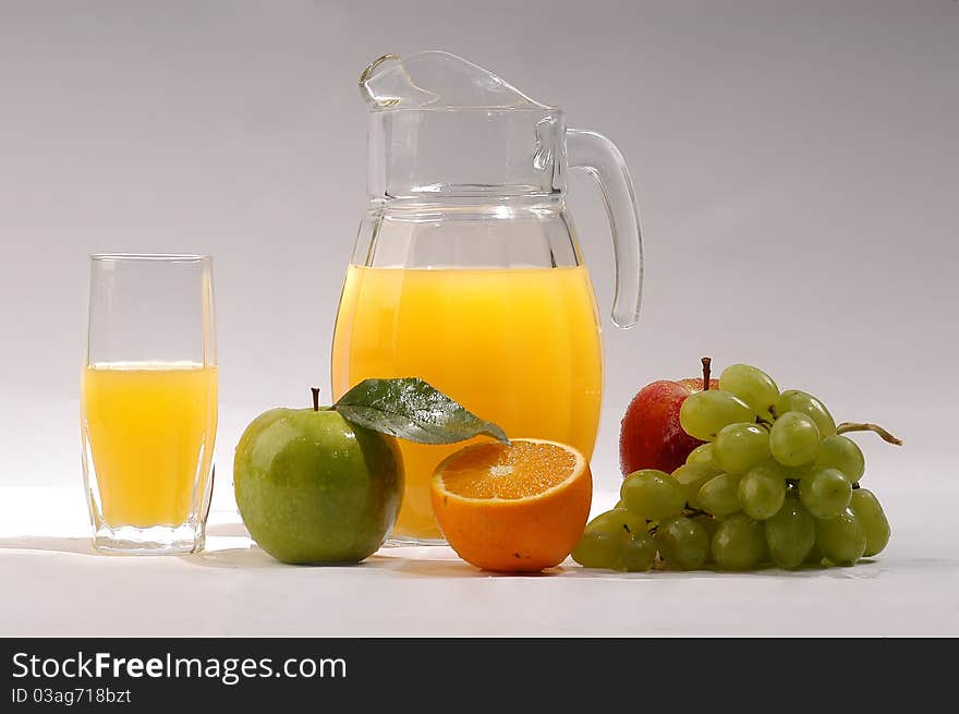 Fresh juice in a jar and fresh fruit