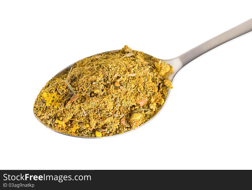 Crushed Asian spices in a spoon isolated on white background