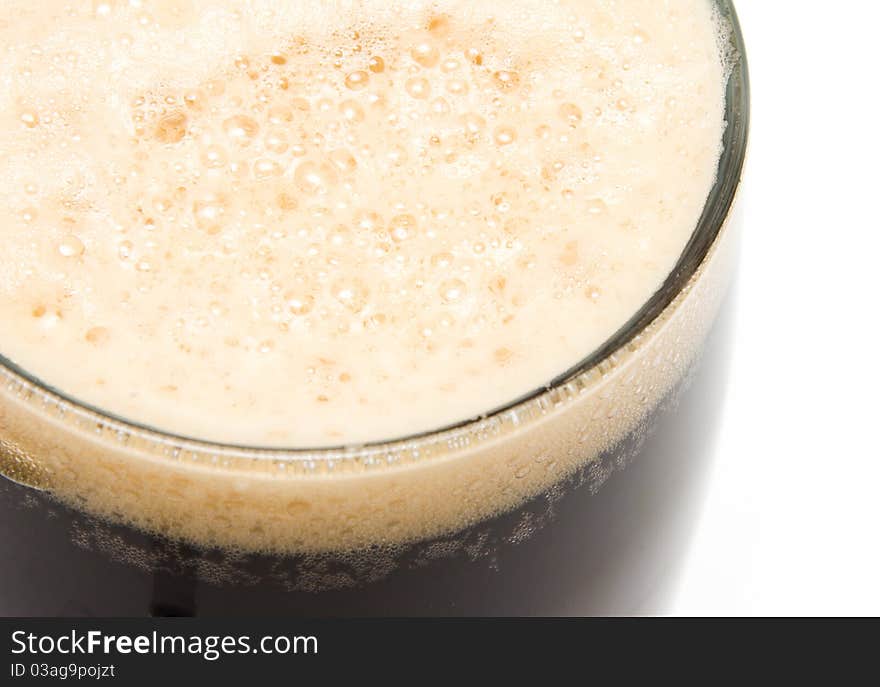 Glass of dark beer close up.