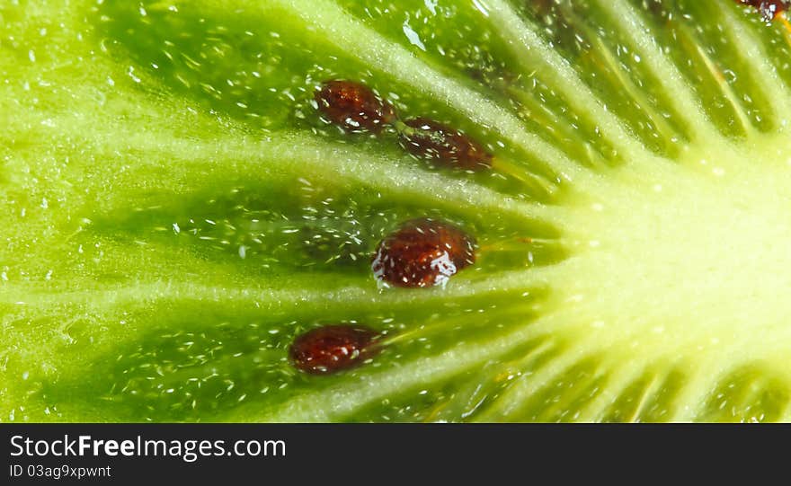 Part of fruit of a kiwi close up. Part of fruit of a kiwi close up