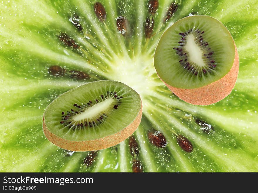 Part of fruit of a kiwi against a close up. Part of fruit of a kiwi against a close up