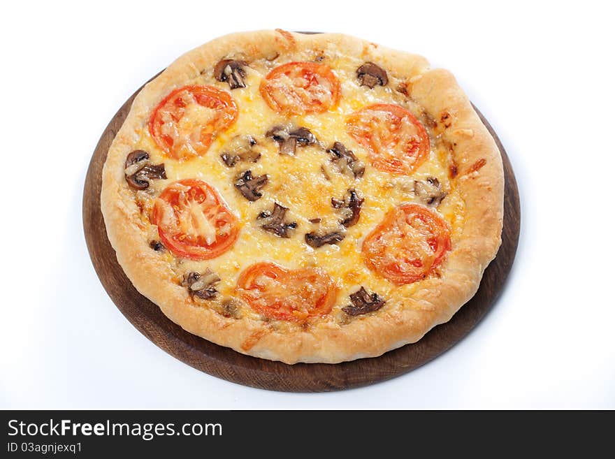 Fresh baked pizza with mushroom and tomatoes