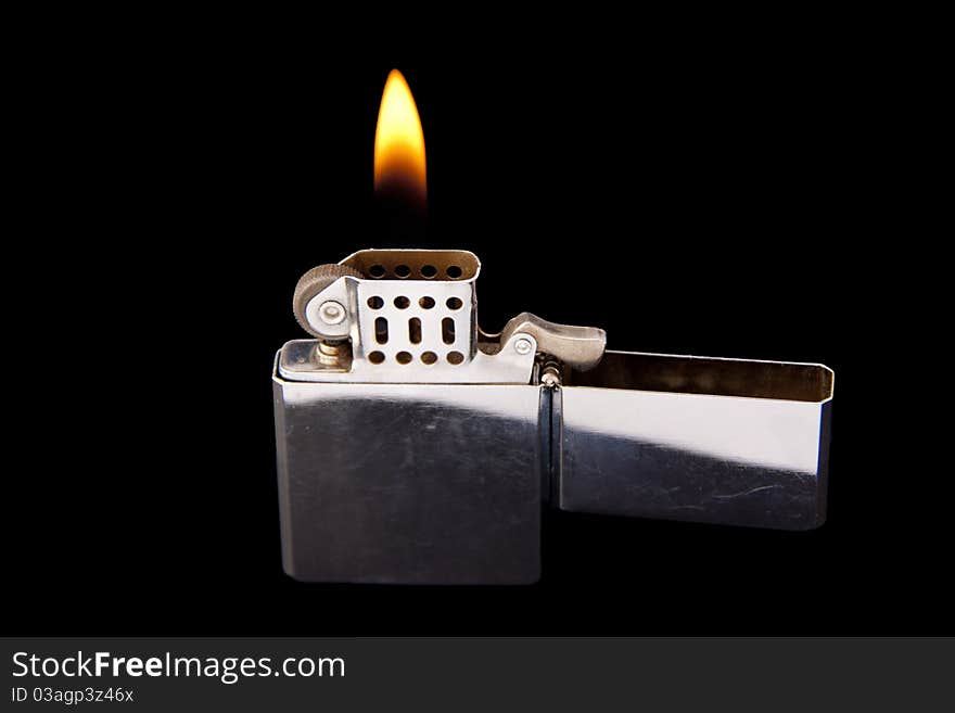 Lighter with Flame on black background