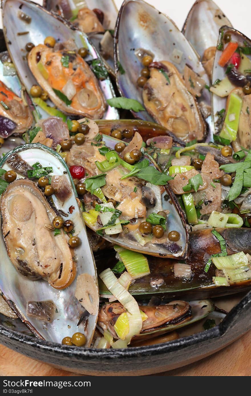 Closeup on moules on wood board. Closeup on moules on wood board