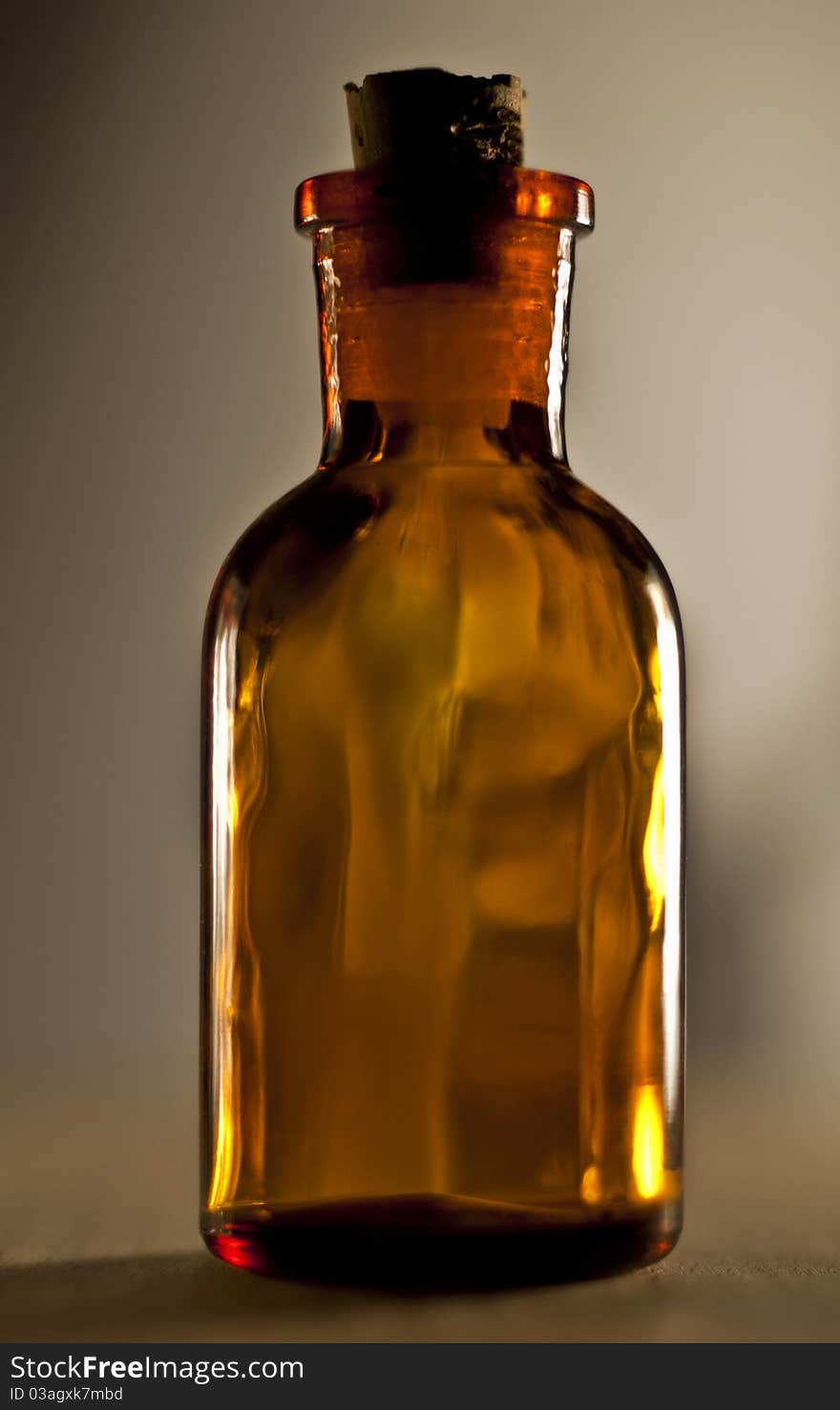 Small glass bottle. with cover (cap). brown glass