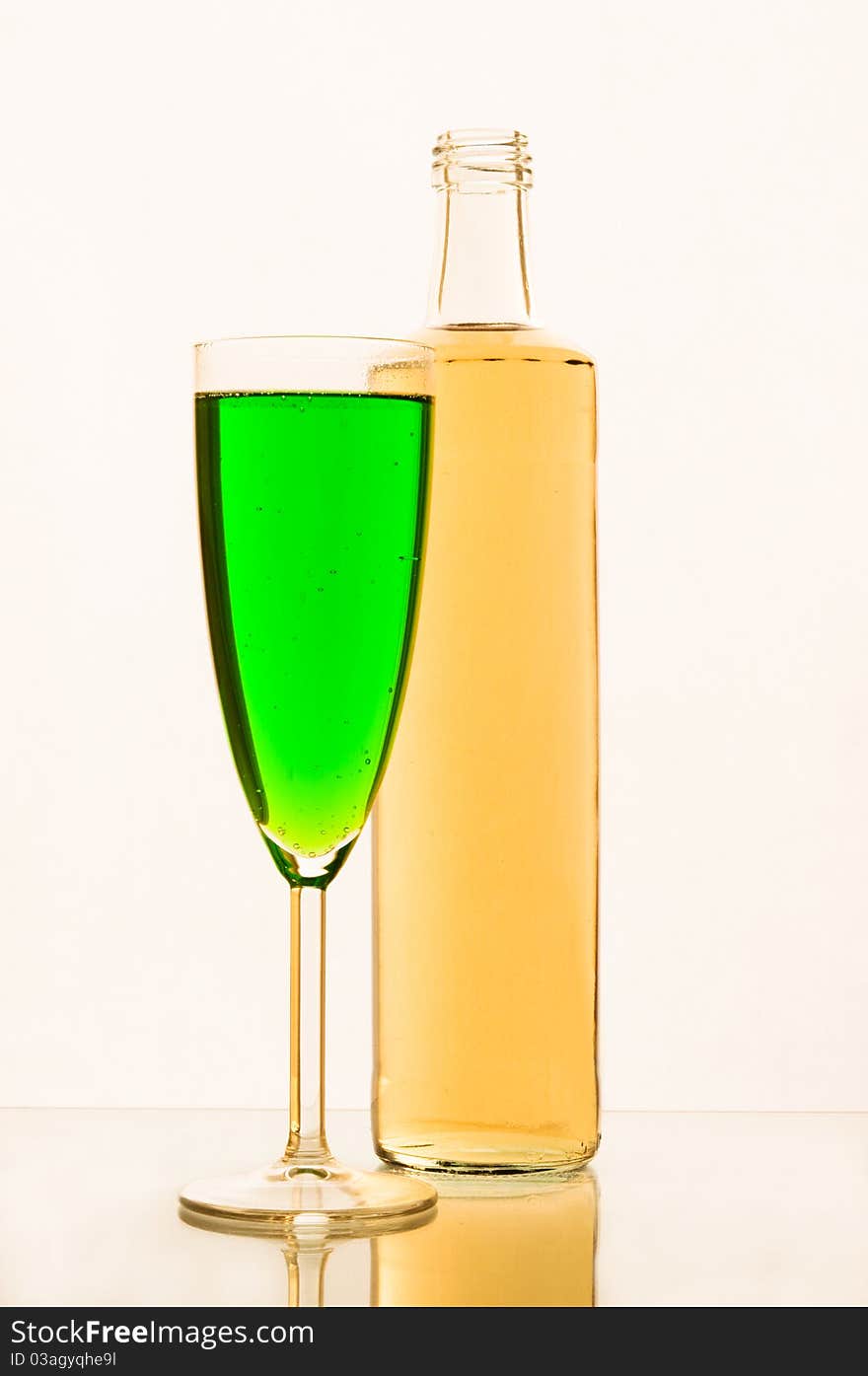 Lemonade in glasses and bottles of green, yellow color