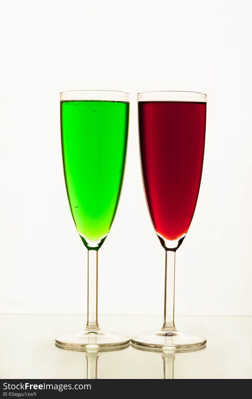 Lemonade in glasses and bottles of red, green color