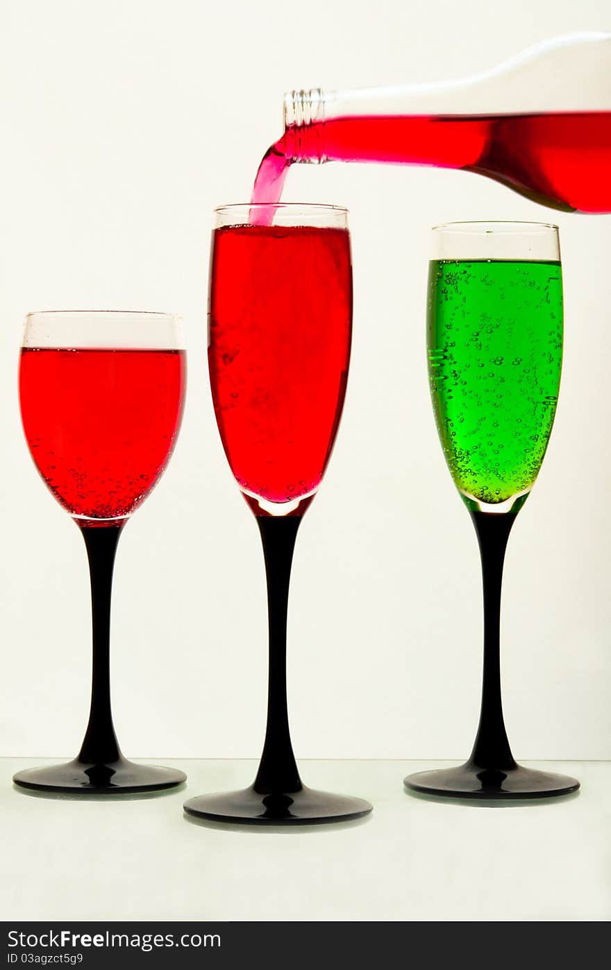 Lemonade in glasses and bottles of  green, red color