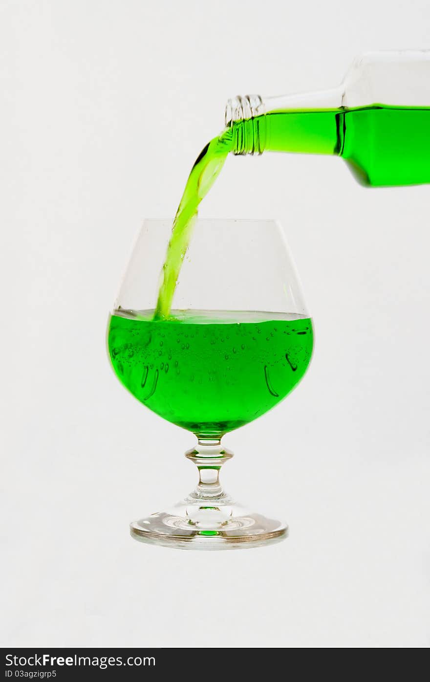 Lemonade in glasses and bottles of  green color