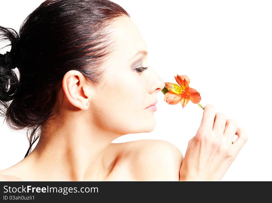 Portrait of beautiful woman with flowers on white background