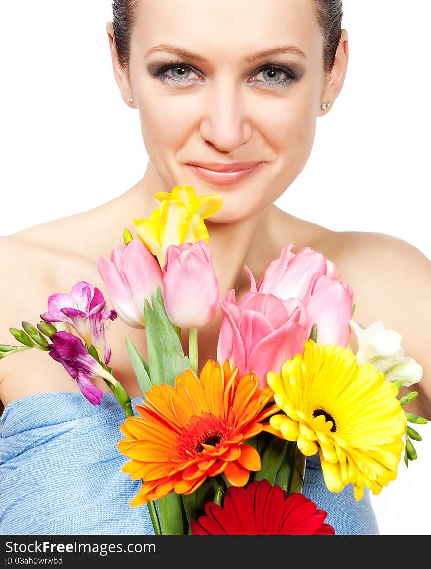 Portrait of beautiful woman with flowers on white background