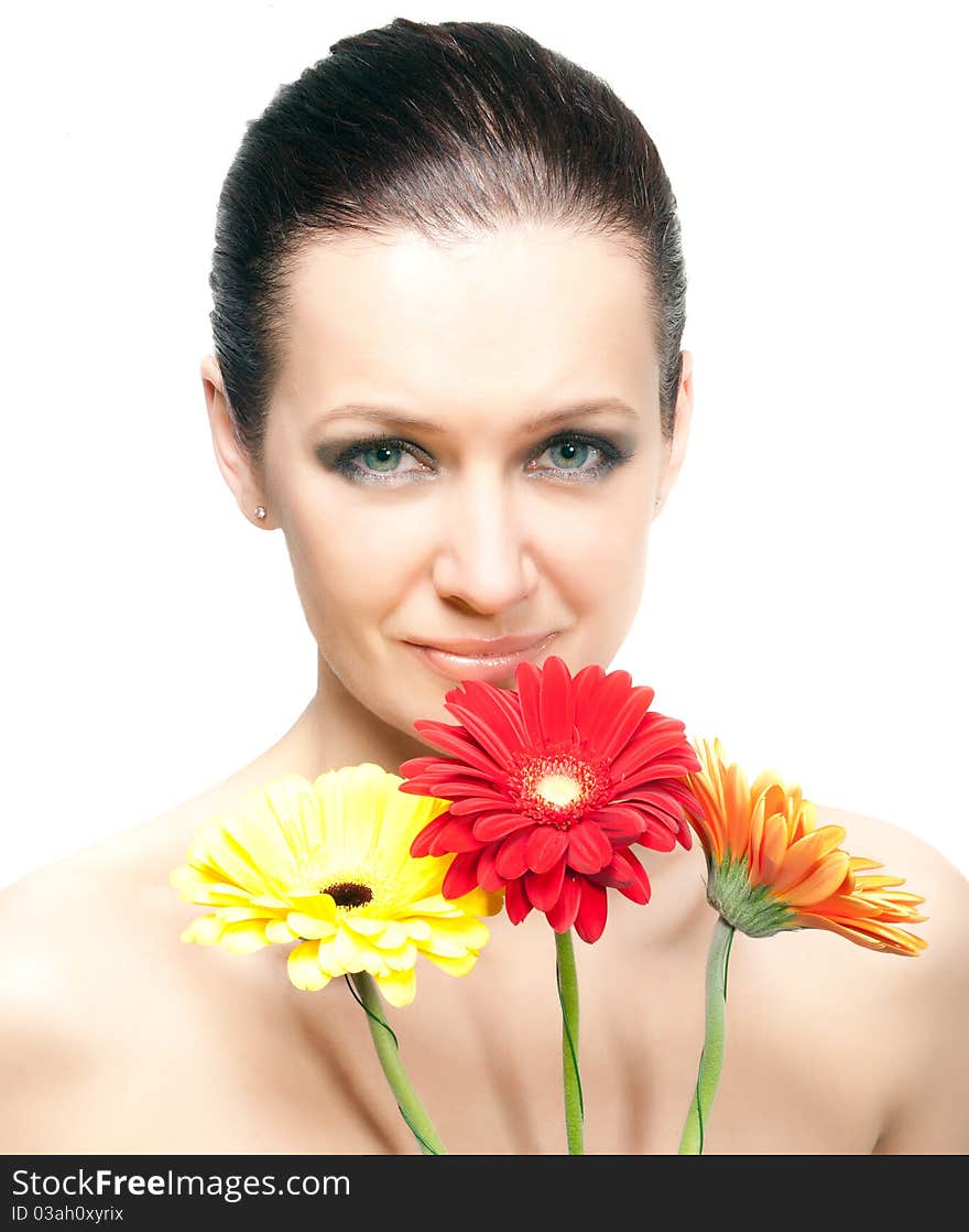 Portrait of beautiful woman with flowers on white background