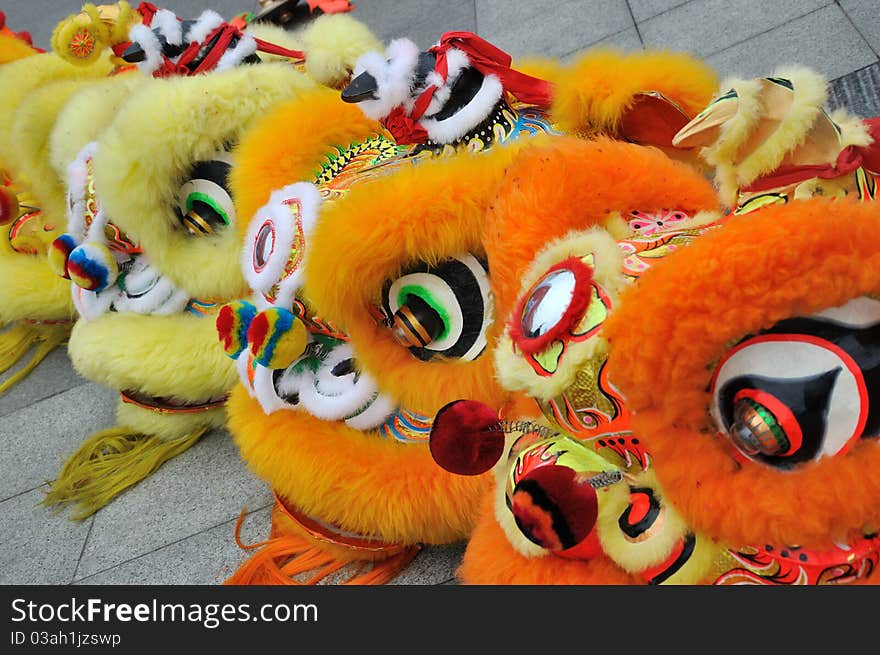 The traditional performing of lion dance in Chinese traditional style, popular in new year day for lucky wish and happiness. The traditional performing of lion dance in Chinese traditional style, popular in new year day for lucky wish and happiness.