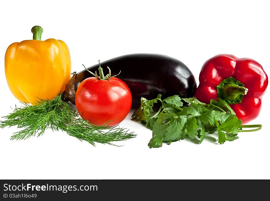 Red and yellow pepper, tomato and eggplant with greens. Red and yellow pepper, tomato and eggplant with greens.