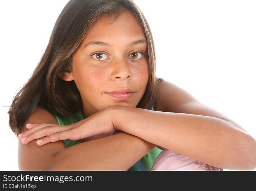 Close up of teenager girl, 13, relaxed with chin resting on hand photographed in studio. Close up of teenager girl, 13, relaxed with chin resting on hand photographed in studio