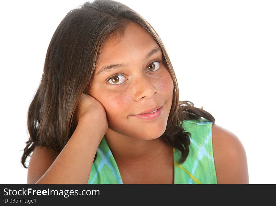 Close up of smiling teenager girl, 13, relaxed with head resting on hand, photographed in studio. Close up of smiling teenager girl, 13, relaxed with head resting on hand, photographed in studio