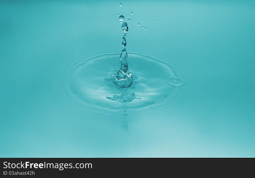 Falling of a drop of water. Water splashing