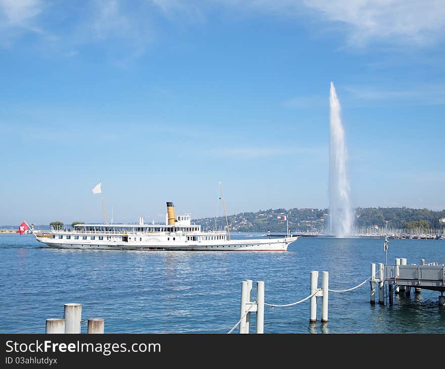 Boat and The Jet d'Eau (Water-Jet) is a large fountain in Geneva, Switzerland, and is one of the city's most famous landmarks. Boat and The Jet d'Eau (Water-Jet) is a large fountain in Geneva, Switzerland, and is one of the city's most famous landmarks.