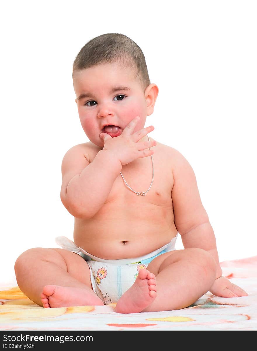 The baby sits on a white background