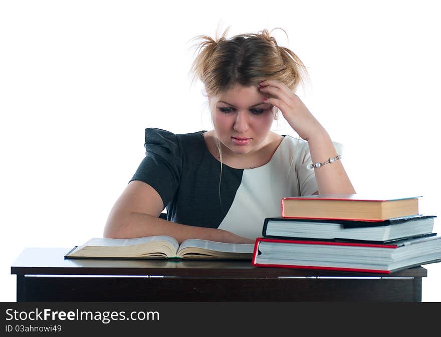 The young student with textbooks prepares for important examination. The young student with textbooks prepares for important examination